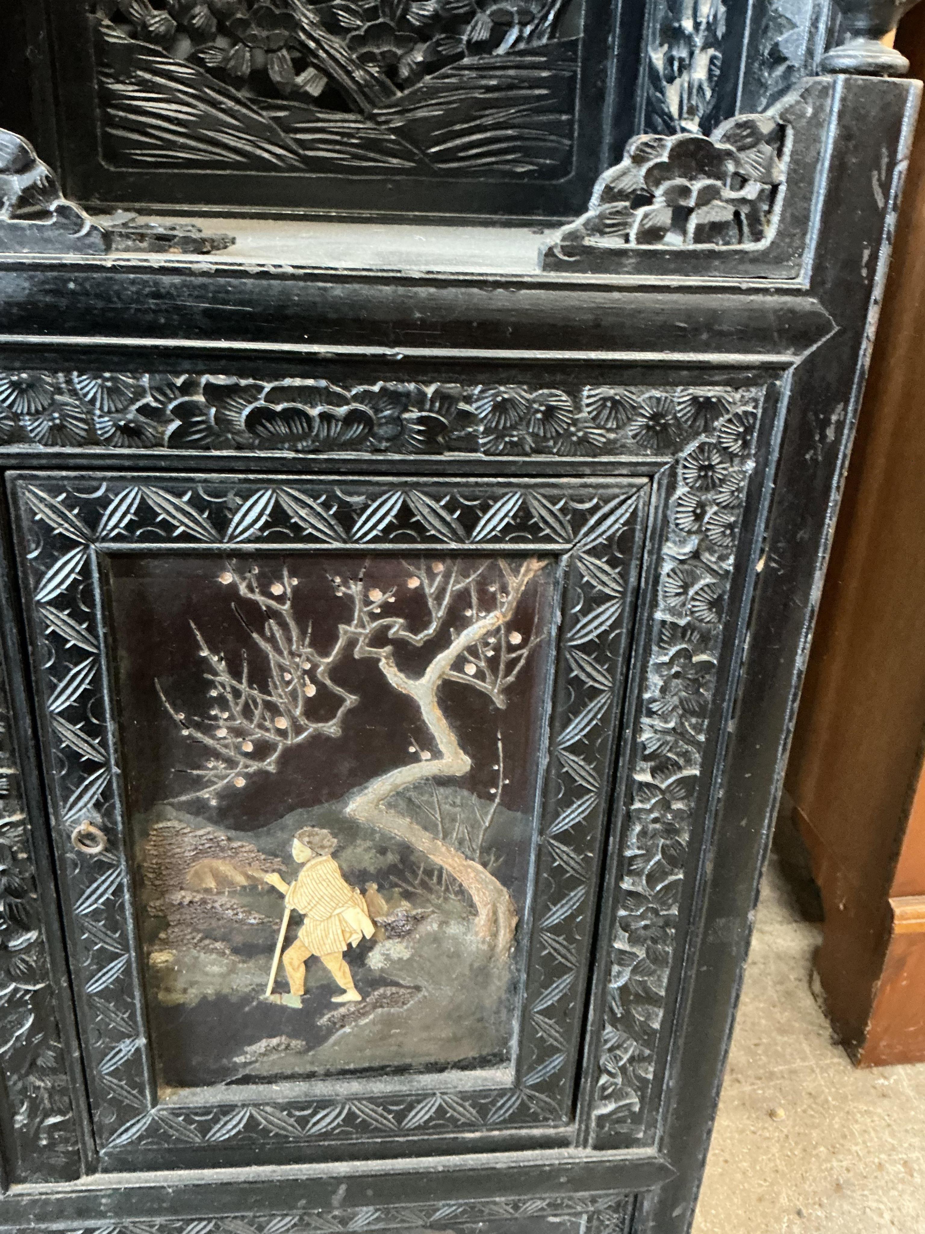 A Japanese Meiji period ebonised cabinet, width 110cm, depth 32cm, height 150cm CITES Submission reference Q4A31H9Q